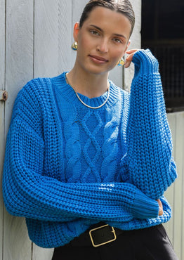 girl wearing blue jumper