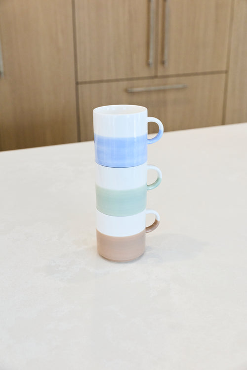 Artist Ice Blue hand painted two tone stackable mug shown stacked above green and taupe mugs; listing is for the blue mug only.