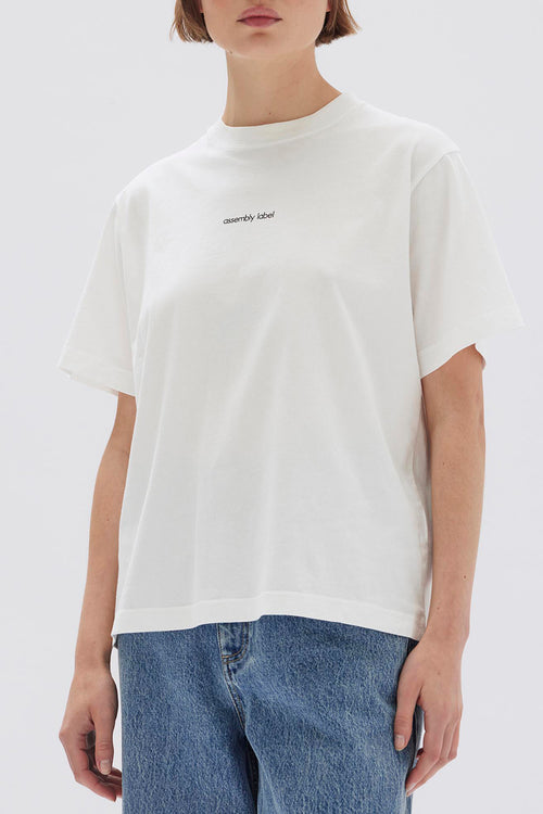 model wears a white tee