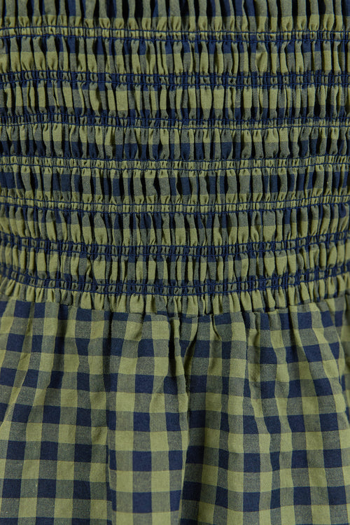 Close-up of green and blue checkered fabric.