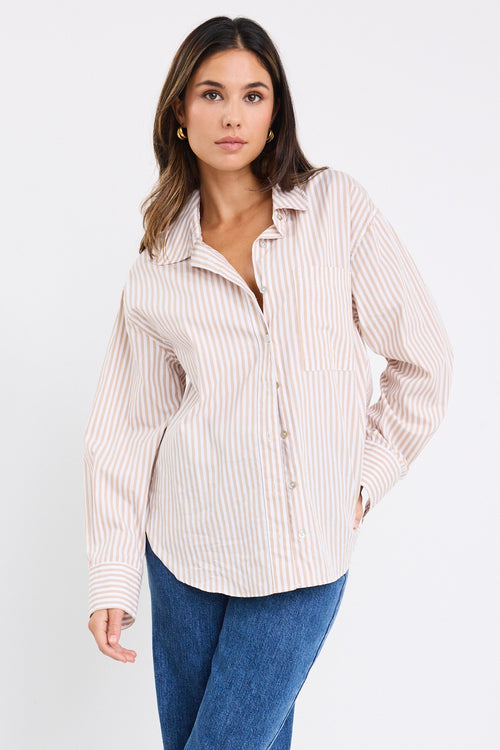 Model wears a stripe white and tan shirt 
@col_pattern