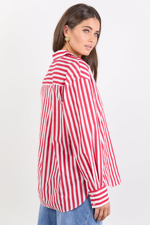 Woman wearing a red and white striped shirt on a white background