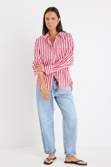 Model wears red stripe shirt and light blue jeans