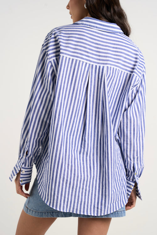 Model wears blue stripe shirt 