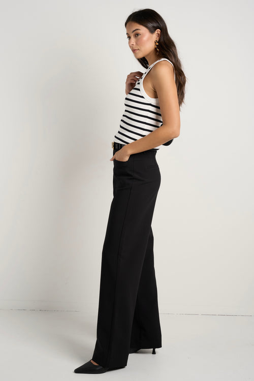 model wears black wide leg pants