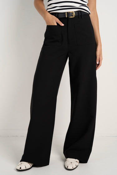 model wears black wide leg pants