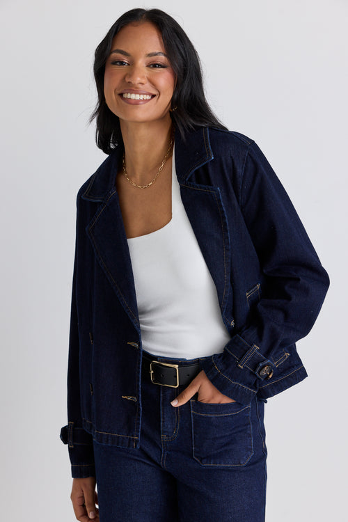 model wears a blue denim jacket