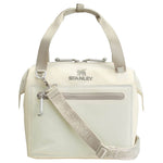 A cream-colored Stanley tote bag with a matching patterned shoulder strap, silver-tone hardware, and the Stanley logo on the front, set against a plain white background.