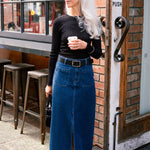 model wears denim skirt