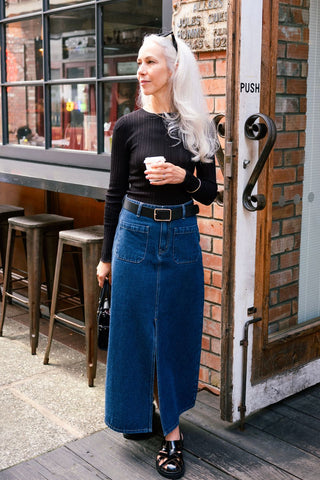 model wears denim skirt