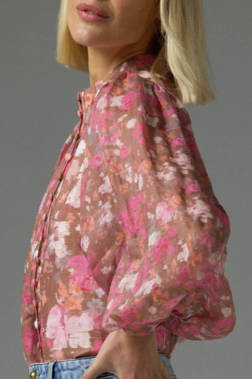 Model wears a pink blush floral high neck blouse