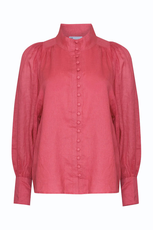 Model wears a high neck hot pink blouse