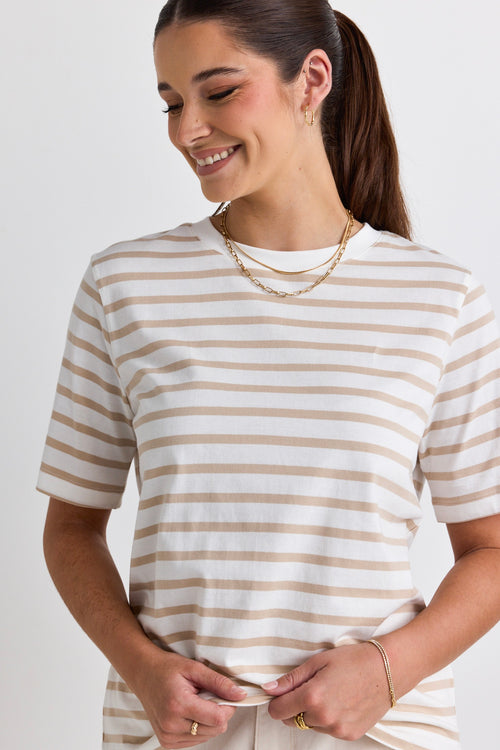  model wears a white and natural stripe tee