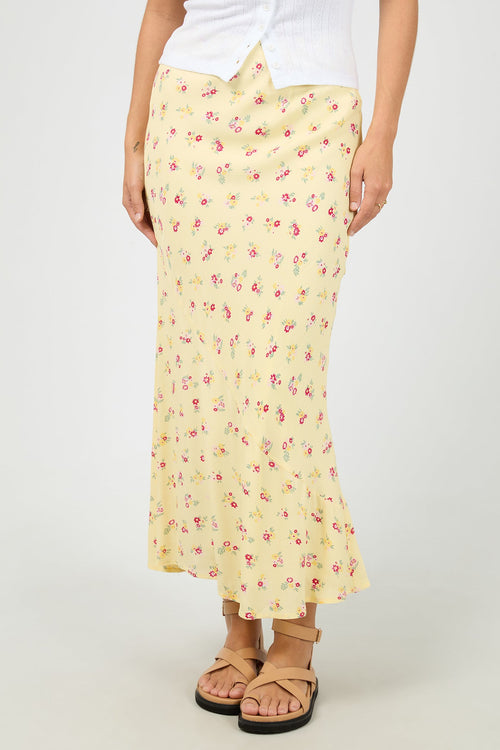 yellow floral maxi skirt with soft pink ditsy print, elasticated waistband, flowy silhouette