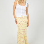 yellow floral maxi skirt with soft pink ditsy print, elasticated waistband, flowy silhouette