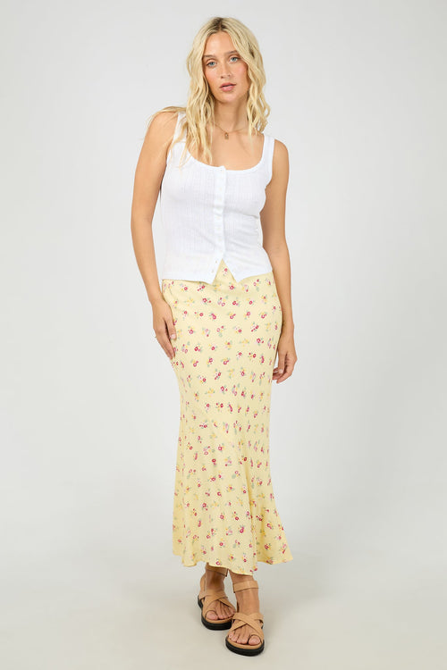 yellow floral maxi skirt with soft pink ditsy print, elasticated waistband, flowy silhouette