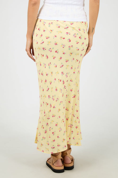 yellow floral maxi skirt with soft pink ditsy print, elasticated waistband, flowy silhouette