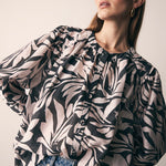 model wears a Black White Print Blouse