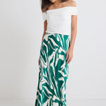 model wears a green print maxi skirt