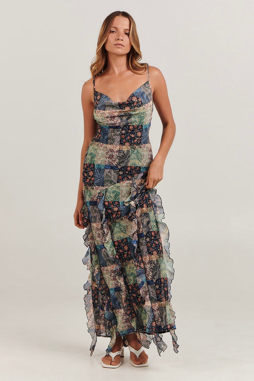 model wears a print maxi dress