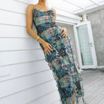 model wears a print maxi dress