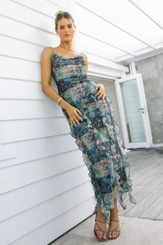 model wears a print maxi dress