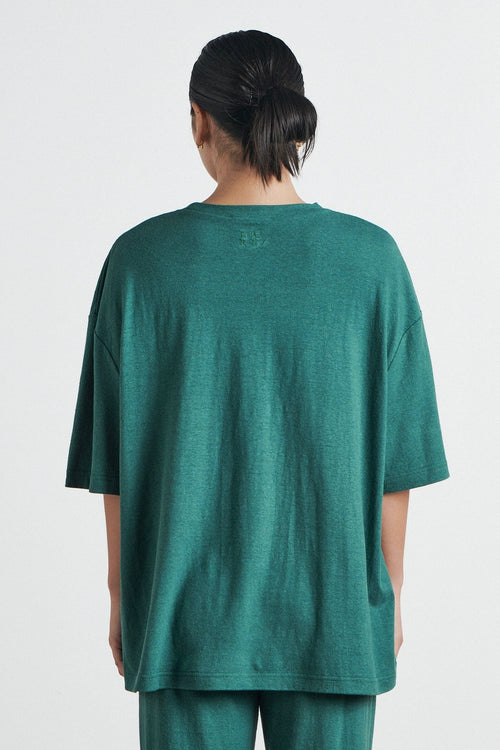 model wears a green t shirt