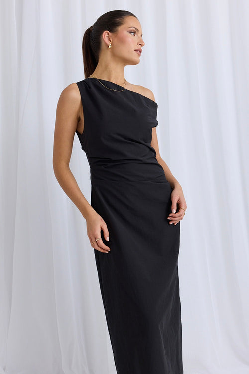 model wears a black one shoulder dress