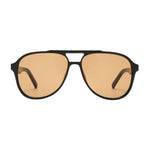 A pair of aviator-style sunglasses with a matte black frame and warm amber-tinted lenses, shown against a plain white background.