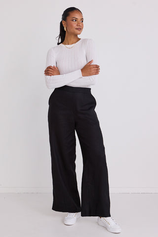 model wears black linen pants