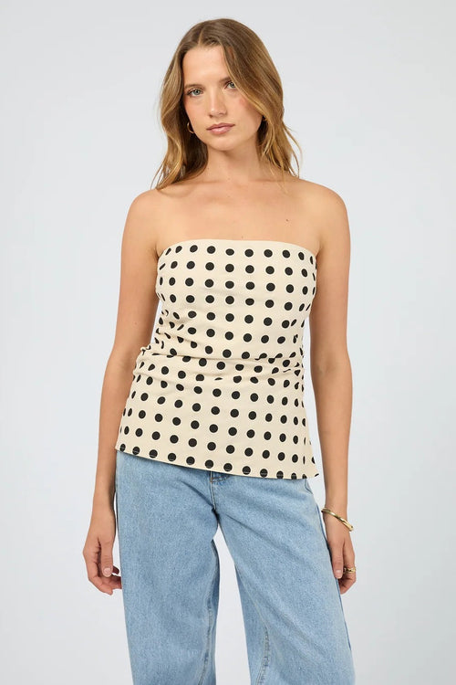 The Nieve Strapless Top worn with light blue denim. 