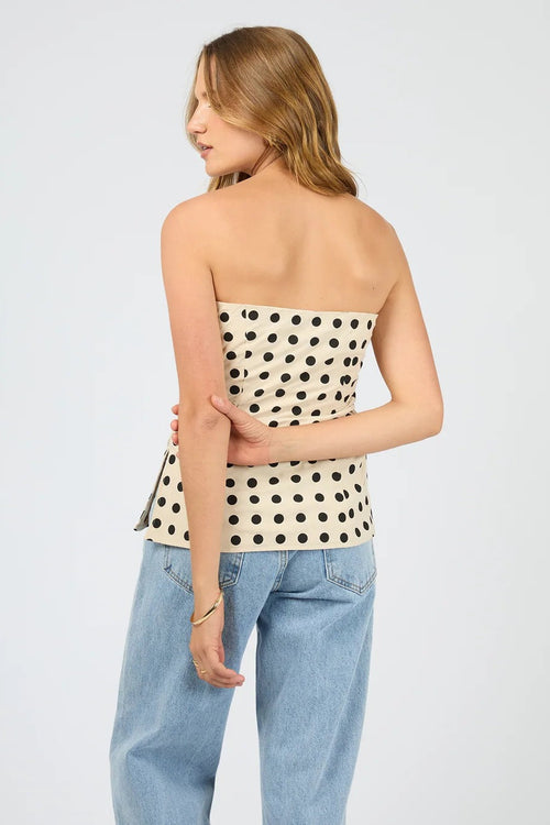 The Nieve Strapless Top worn with light blue denim. 