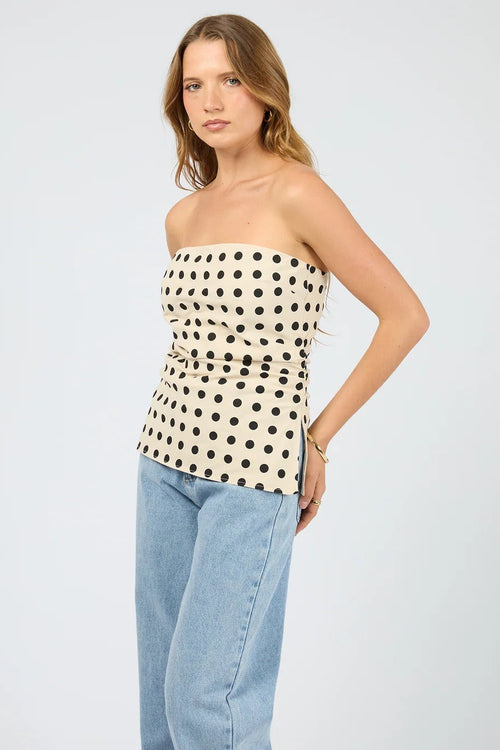 The Nieve Strapless Top worn with light blue denim. 