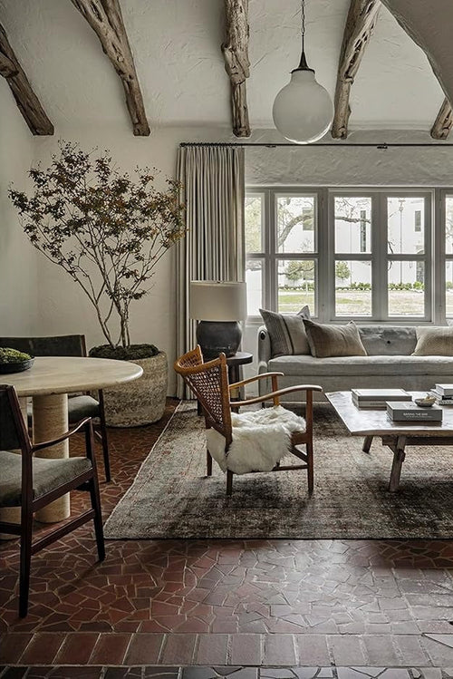Interior design magazine spread with a living room and dining area.
