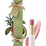Lipstick with green packaging and avocado illustration on a white background