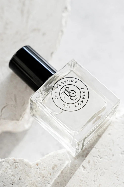 Perfume bottle with 'The Perfume Oil Company' label on a light background