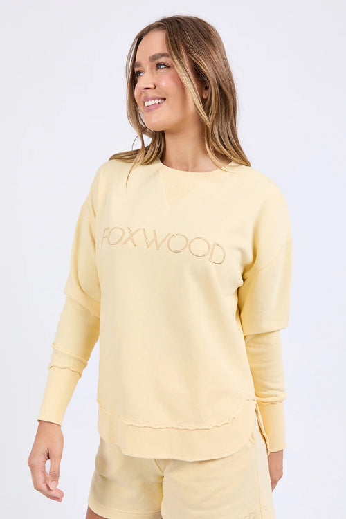 Woman wearing lemon crew neck