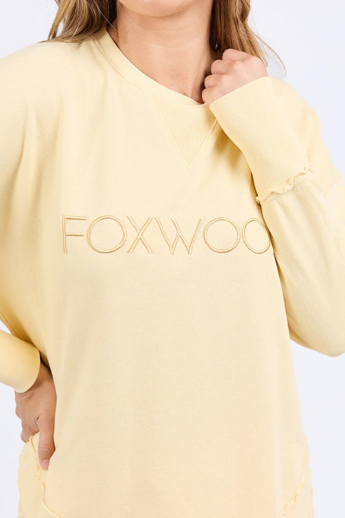 Woman wearing lemon crew neck