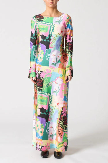 Woman wearing a colorful floral dress on a white background