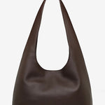 Brown leather shoulder bag on a light gray background
