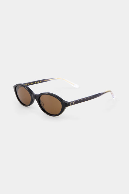 Sunglasses with a black frame and brown lenses on a white background