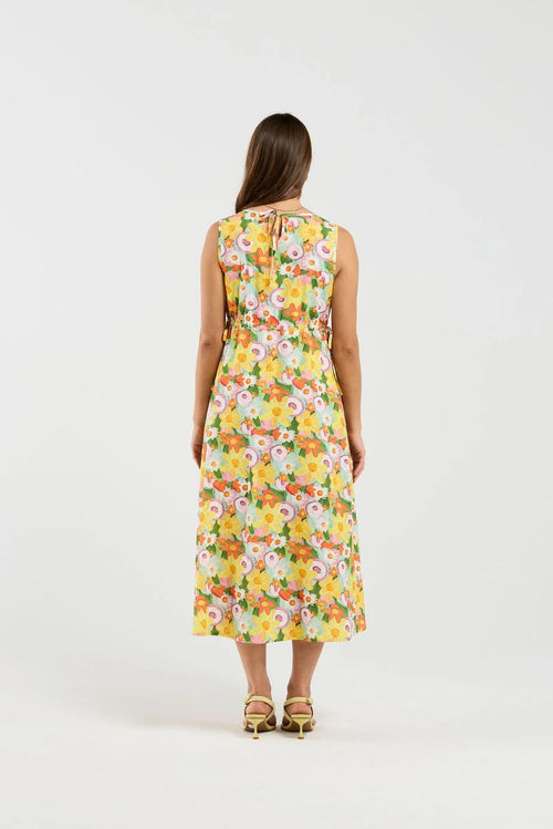 Woman wearing a floral dress on a white background