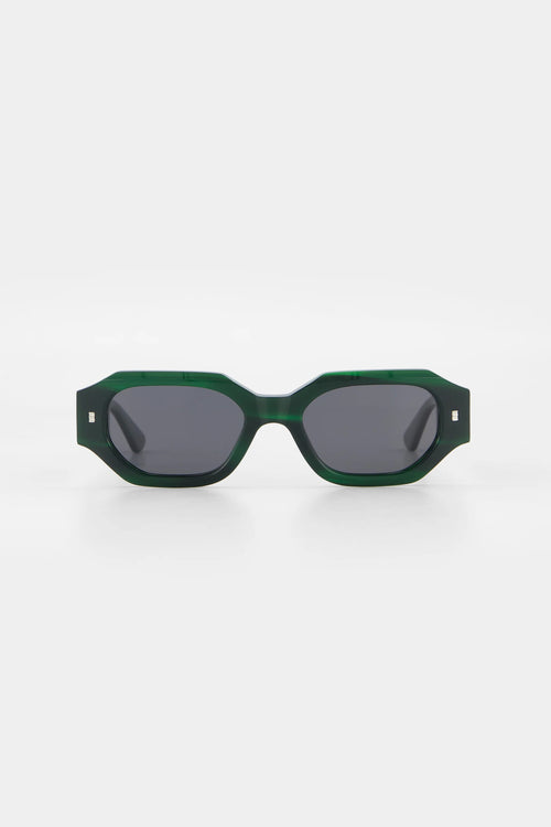 Green sunglasses with dark lenses on a white background
