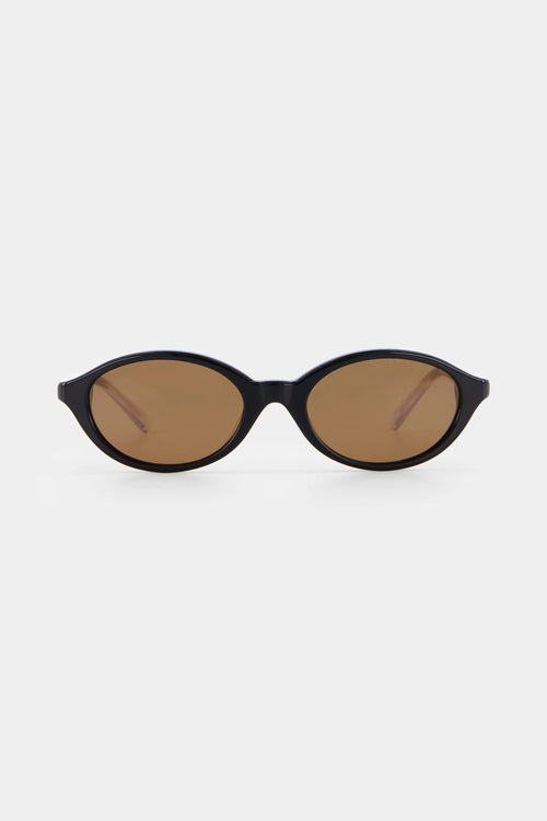 Black sunglasses with brown lenses on a white background