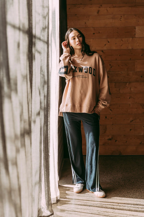 Model wears tan foxwood crewneck jumper
