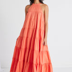 model in orange maxi dress