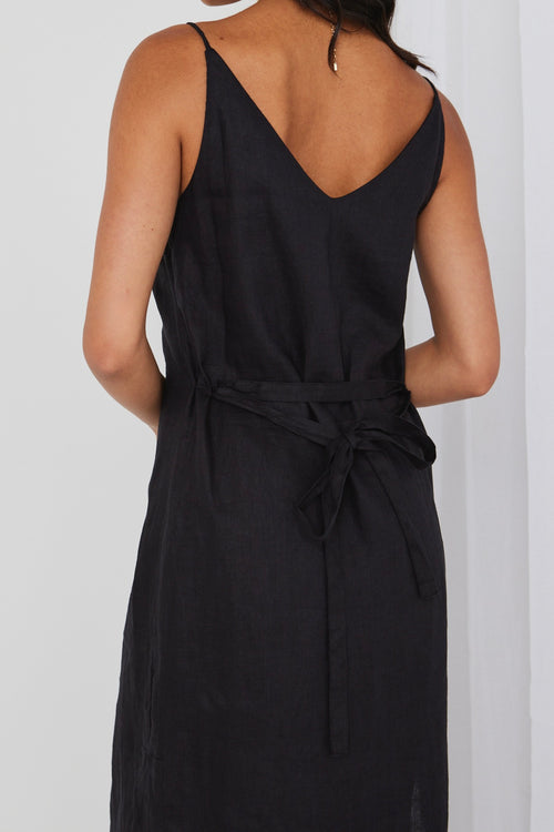 model wears black linen midi dress