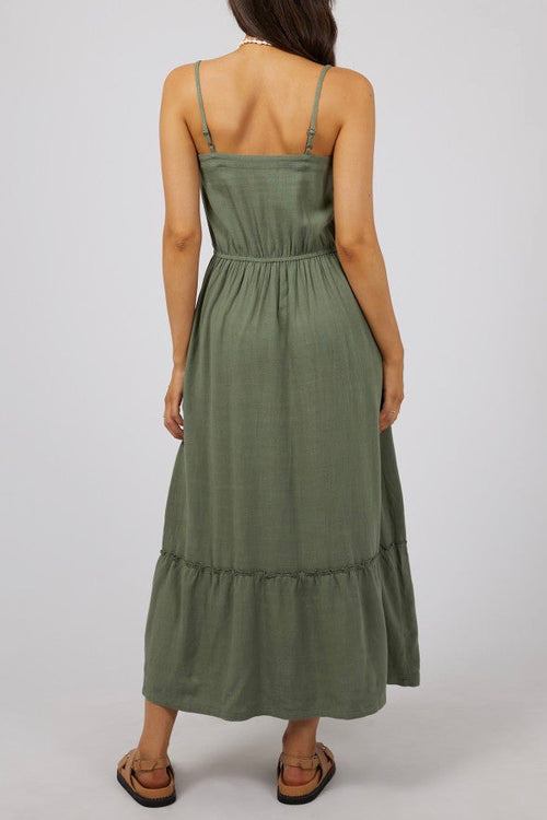 model wears a green maxi dress