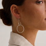 model wears silver hoop earring