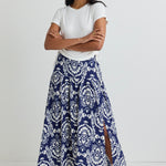 model wears a blue print maxi skirt